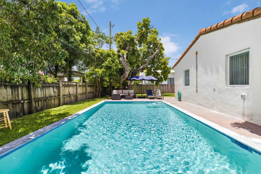 a swimming pool in the backyard of a house at Modern 4BR Retreat with Private Pool - Near Brickell in Miami