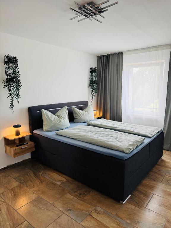 a bedroom with a large bed in a room at Zentraler Moment in Chemnitz