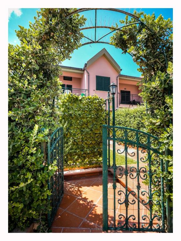 an entrance to a garden with an iron gate at Casetta mia Seaside in Buonfornello