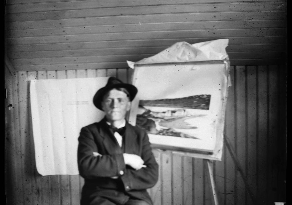 Una foto antigua de un hombre sentado junto a un cuadro. en Valey Luxury - Icelandic Countryside Escape, en Hvammstangi