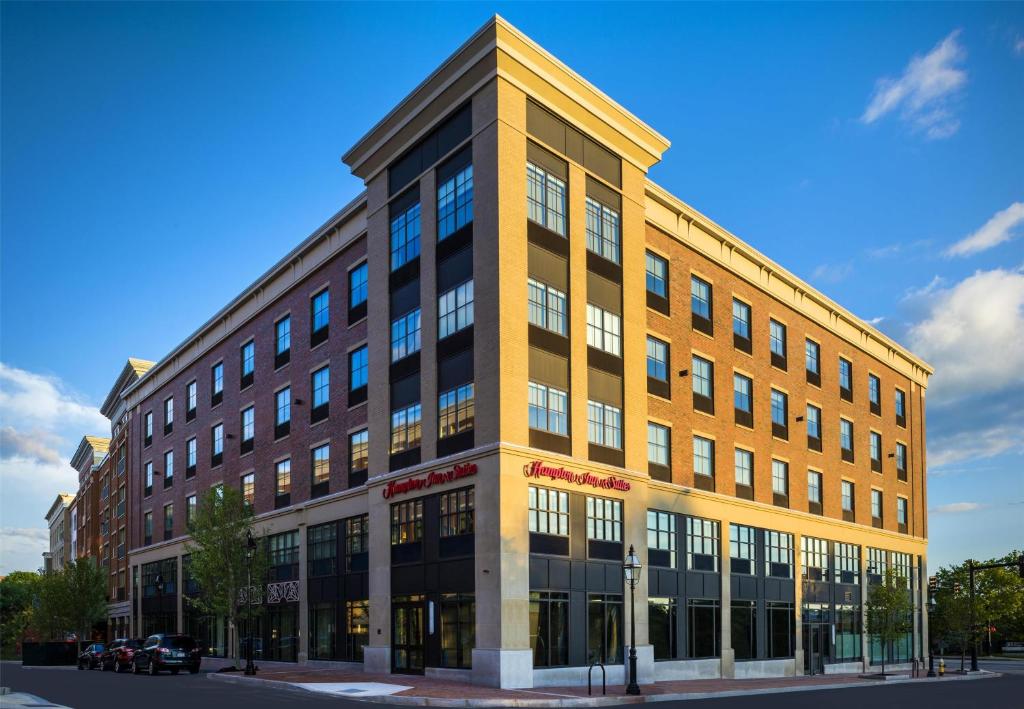 a large brick building on a city street at Hampton Inn & Suites Portsmouth Downtown in Portsmouth