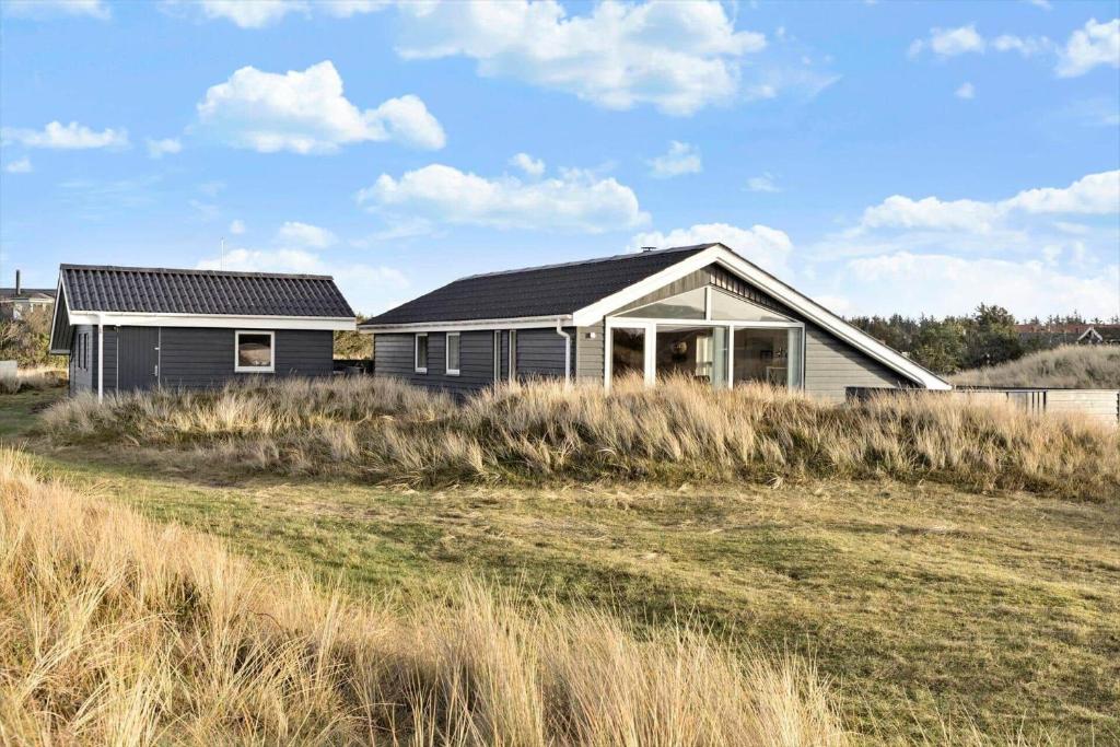 a house in the middle of a field at 1059-Klitmoller-Mollebakken-56 in Klitmøller