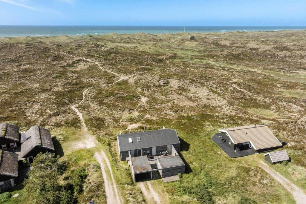 an aerial view of a house with the ocean in the background at 768-Snedsted-Somaerkevej-68 in Snedsted