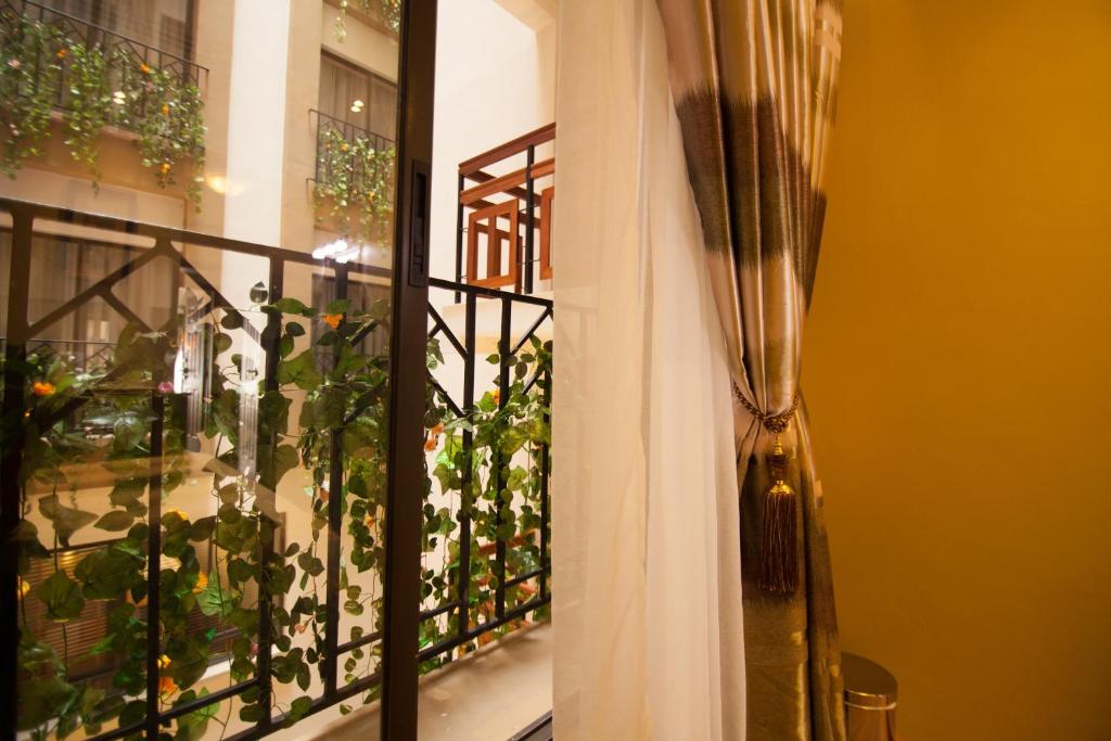 a balcony with a view of a plant at After 40 Hotel in Nairobi