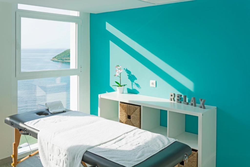 Postel nebo postele na pokoji v ubytování HSM Sandalo Beach