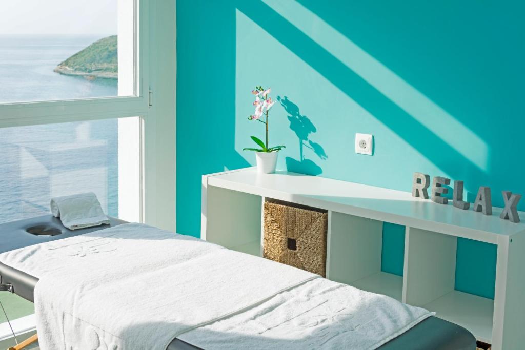 Postel nebo postele na pokoji v ubytování HSM Sandalo Beach