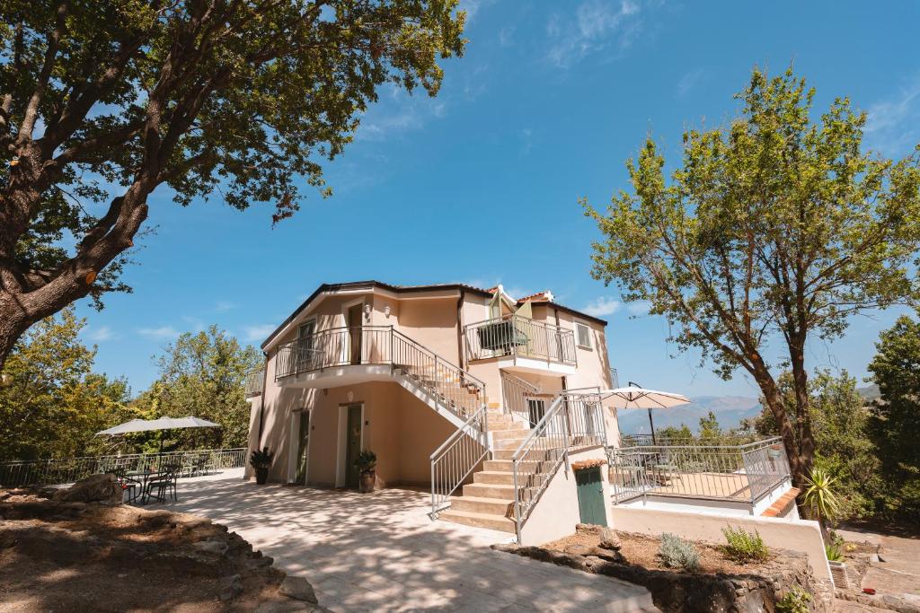 a house with stairs leading up to it at Dimora delle Acque - Altavista Residence in San Nicola Arcella