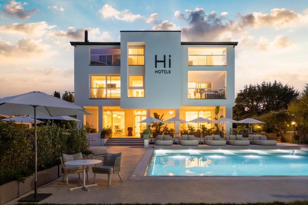 a rendering of a villa with a swimming pool at Hi Hotels Sirmione - Lakeview Pool in Sirmione