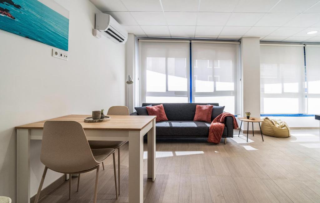 a living room with a couch and a table at 1 Bedroom Stunning Apartment In Grao De Castellon in Grao de Castellón