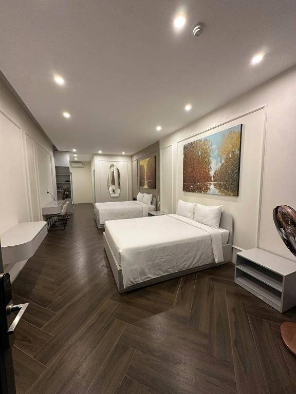 En eller flere senge i et værelse på DD hotel