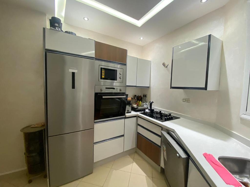 Η κουζίνα ή μικρή κουζίνα στο Appartement luxueux