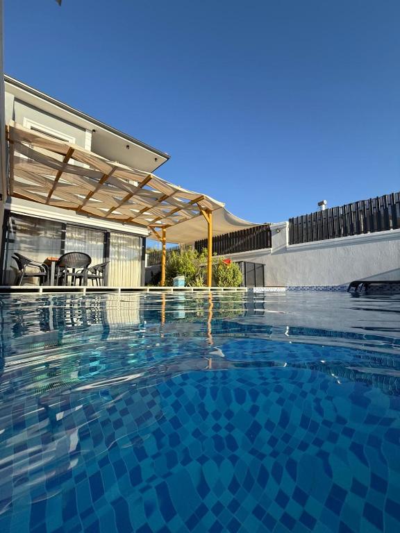 a swimming pool with a clear blue at Villa Zena Demre in Demre