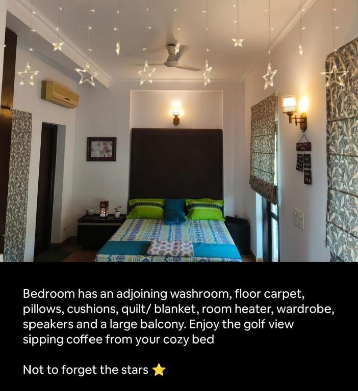 a bedroom with a bed with green pillows at Quiet Retreat in Tarudhan Golf Valley, Tauru, Manesar in Manesar