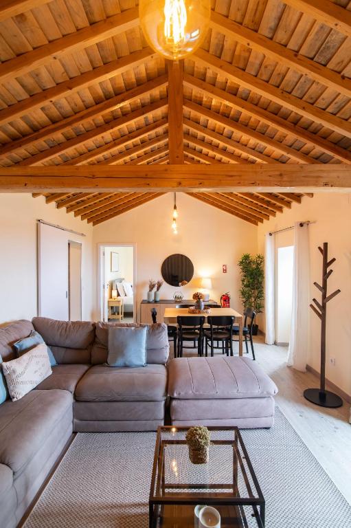 a living room with a couch and a table at Atlantic Seaview Window in Feteiras