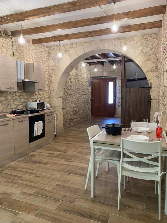 a kitchen with a table and chairs in a room at Dani's House Holiday in Cagliari