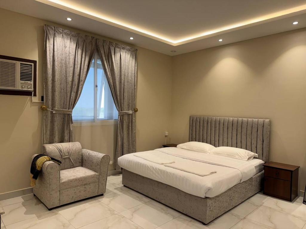 Postel nebo postele na pokoji v ubytování ركن صحاري للشقق المخدومة 3 المروج Rukn Sahari for Served Apartments