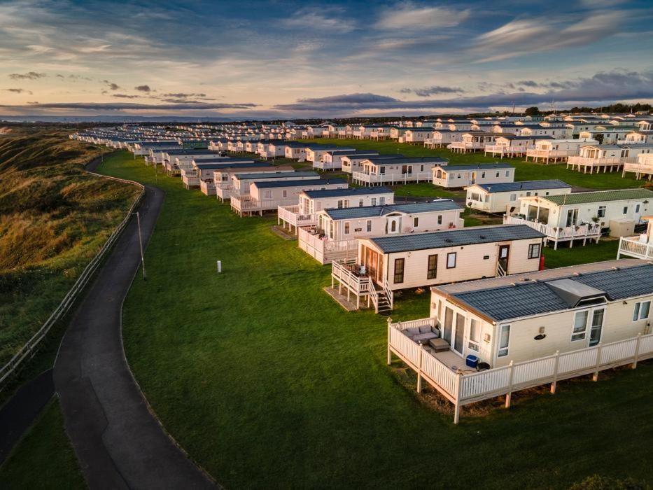an aerial view of a row of houses at Sea View by the beach at Crimdon Dene Holiday Park in Hartlepool