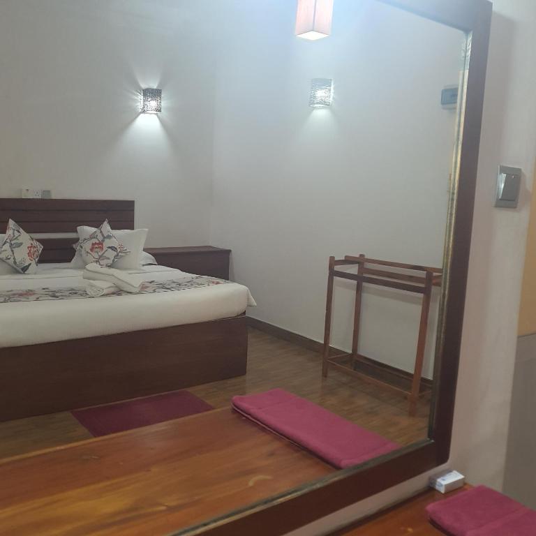 Postel nebo postele na pokoji v ubytování Blooming Holiday Resort