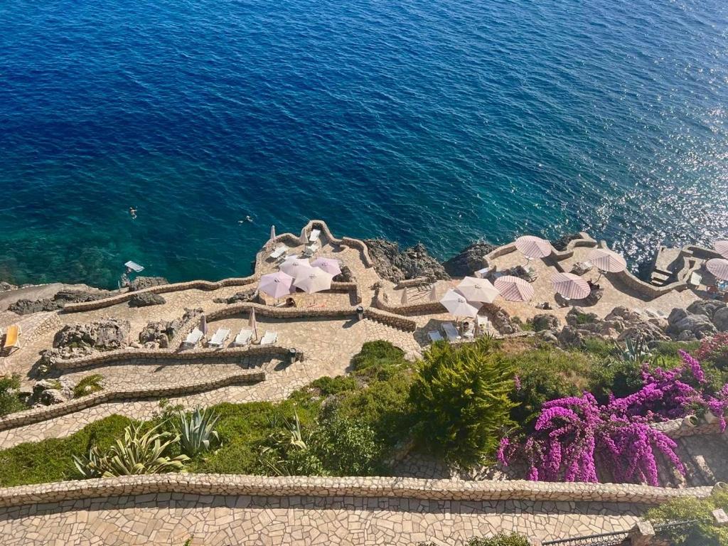 an aerial view of a resort next to the ocean at Modern Seaview Apartment with a Pool in Dobra Voda