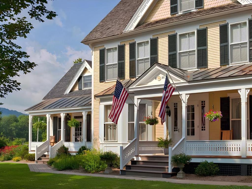 a house with two american flags on the porch at The Jackson in Woodstock