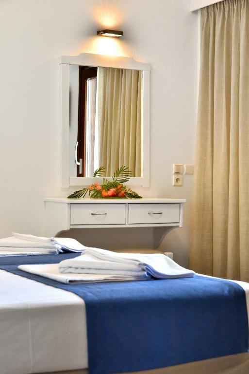 Un ou plusieurs lits dans un hébergement de l'établissement Hotel Korali