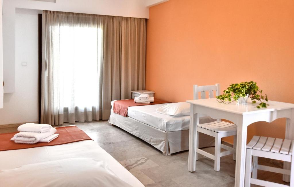 Un ou plusieurs lits dans un hébergement de l'établissement Hotel Korali