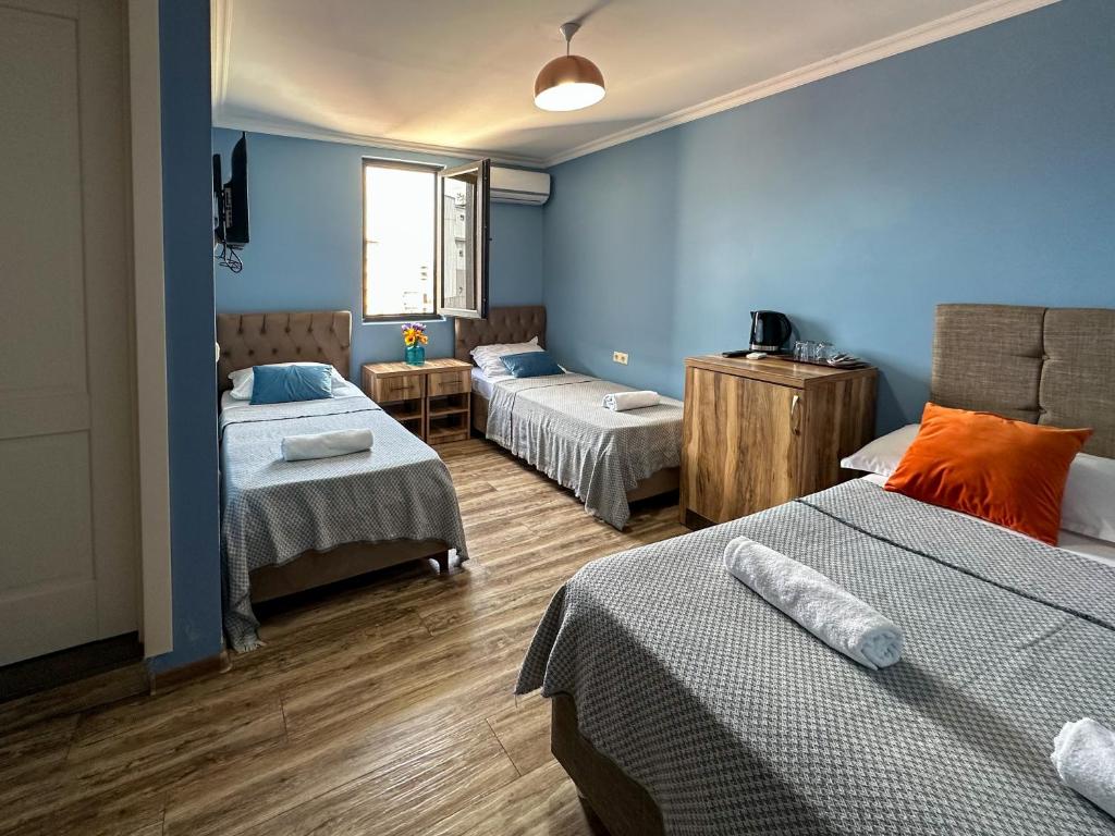 Ένα ή περισσότερα κρεβάτια σε δωμάτιο στο Aquamarinn