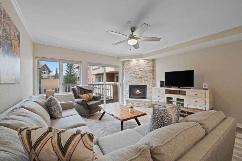 a living room with a couch and a tv at St James Place 216 in Beaver Creek