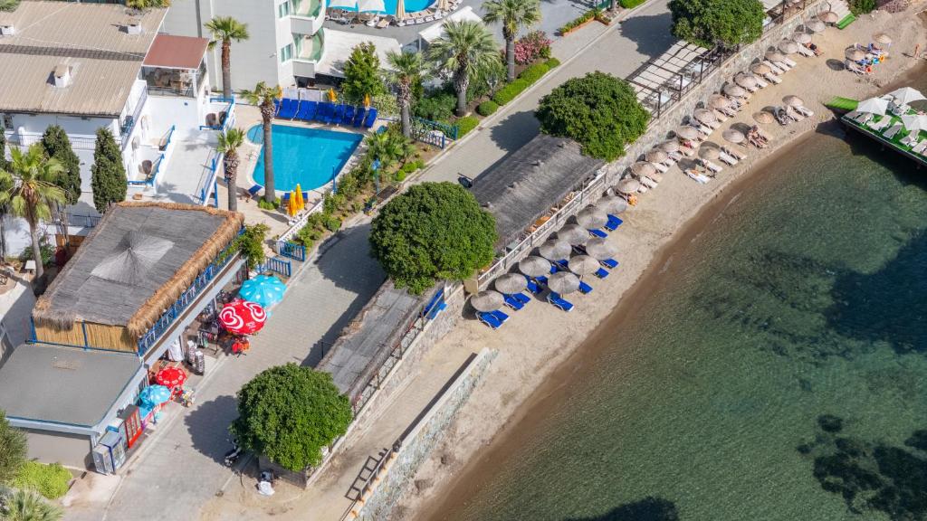 an aerial view of a beach with a resort at MaxSea Beach Hotel in Bodrum City