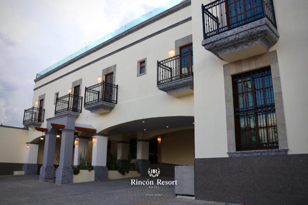 a white building with balconies on the side of it at Hotel RINCON RESORT TEQUILA in Tequila