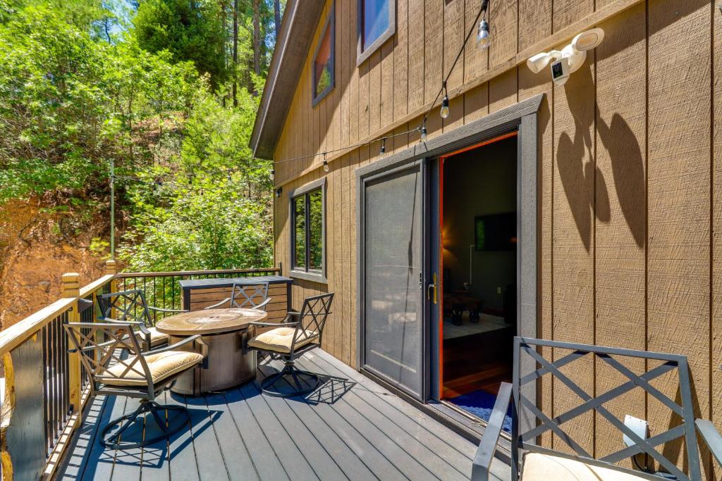 a patio with a table and chairs on a deck at Families Welcome Quiet Cabin Less Than 5 Mi to Cloudcroft in Cloudcroft