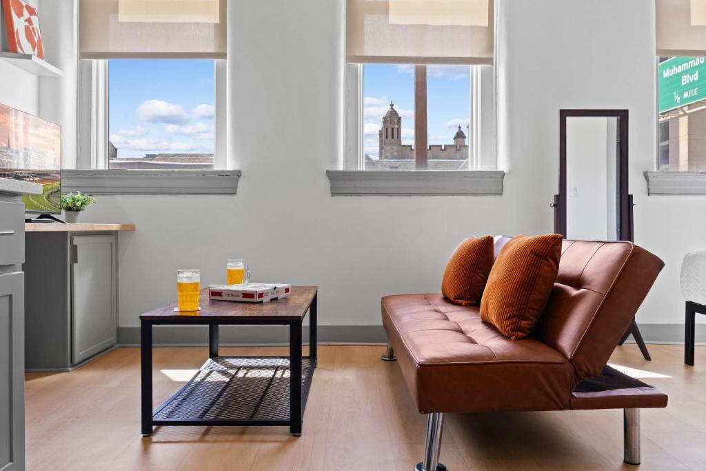 a living room with a couch and a table at Bright and Modern Studio in Louisville # 303 in Louisville