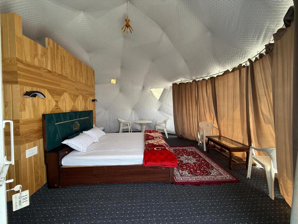 a bedroom with a bed in a tent at North Cliff Cafe & Retreat in Srinagar