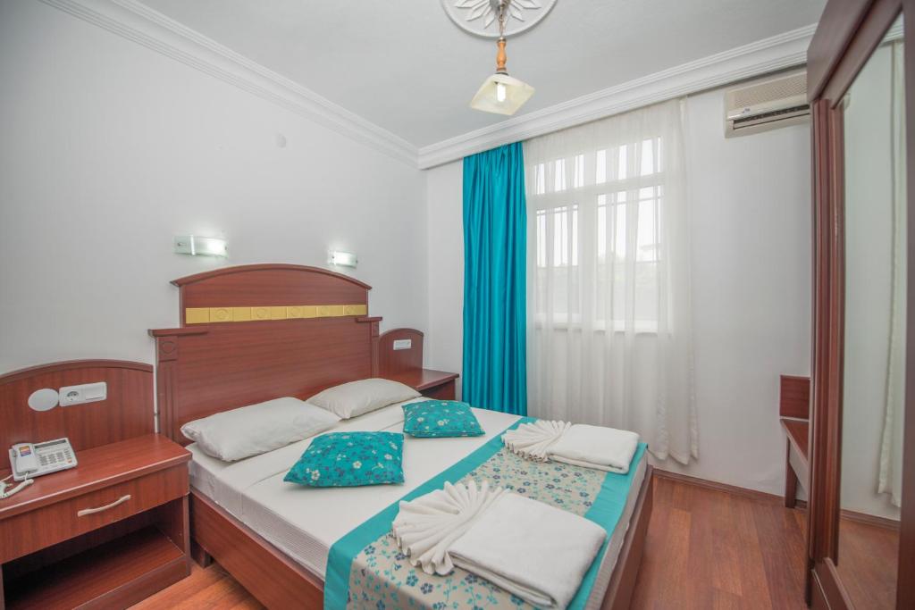 Postel nebo postele na pokoji v ubytování Sunberk Hotel
