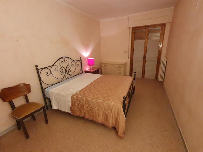 Ένα ή περισσότερα κρεβάτια σε δωμάτιο στο Casa Vacanze Sant'Andrea