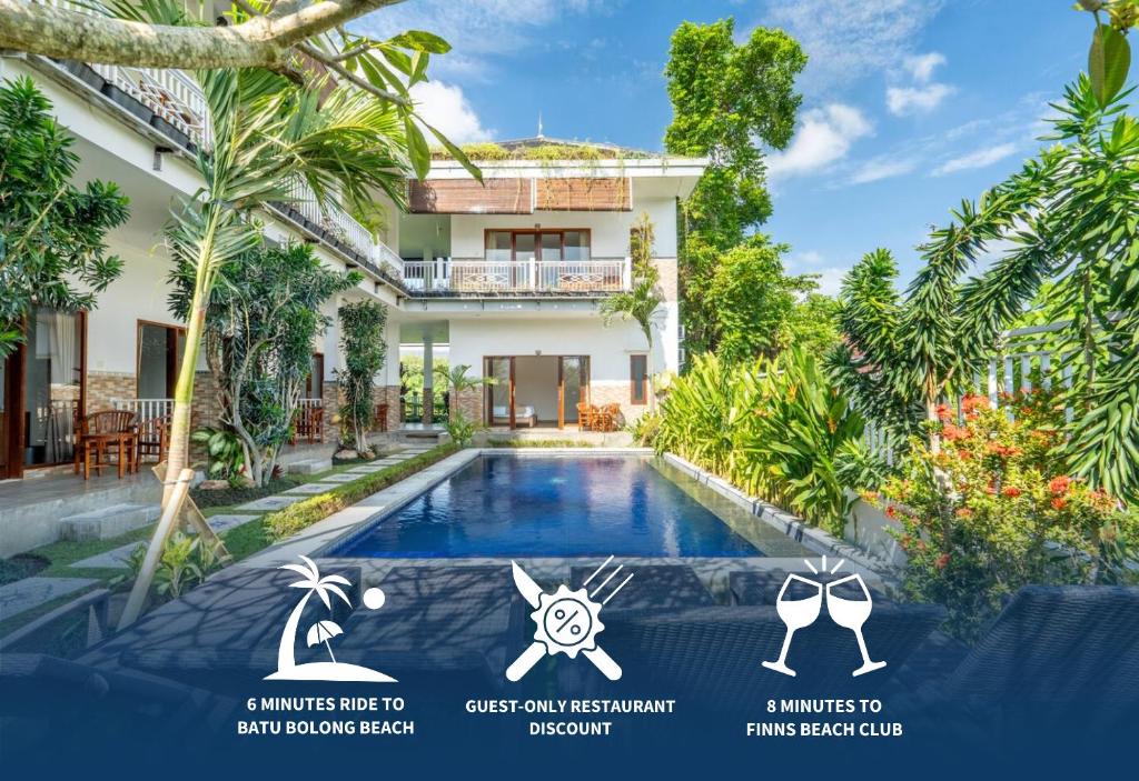a villa with a swimming pool in front of a house at Pondok Bagus by Bukit Vista in Canggu