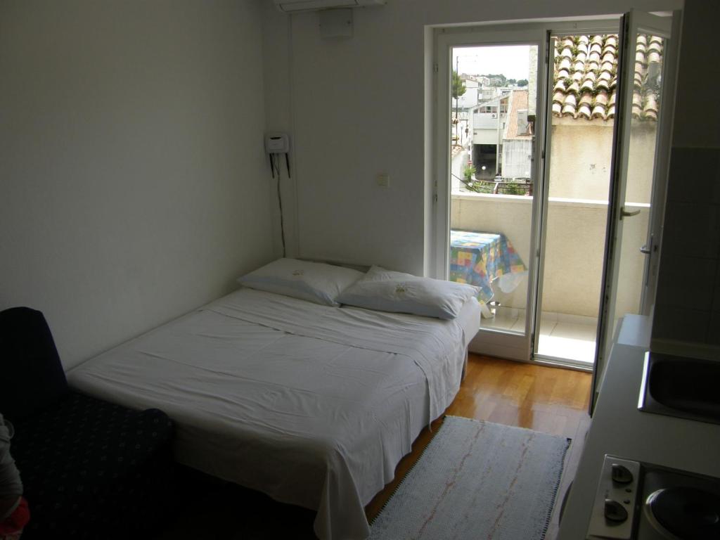 Posteľ alebo postele v izbe v ubytovaní Apartments Jakova Dudana 10