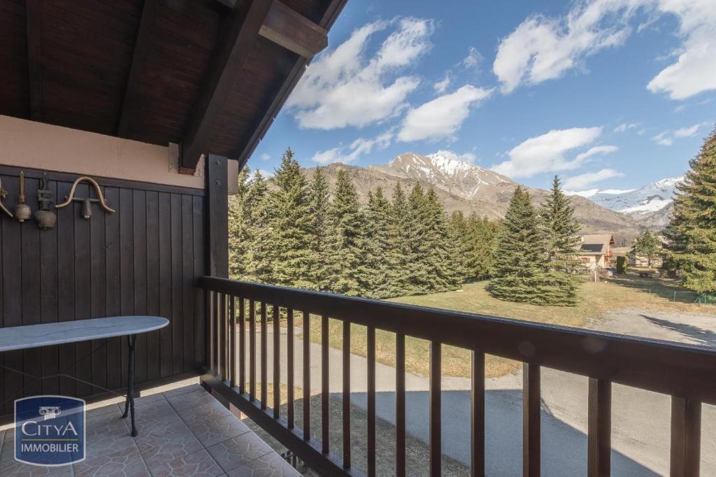 a balcony with a view of the mountains at Appart Tallas Pieds Des Pistes in Ancelle
