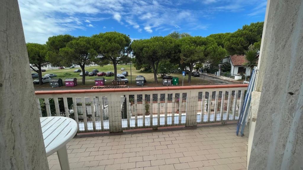 a balcony with a view of a parking lot at Villa Laura 1 Piano in Lido di Pomposa