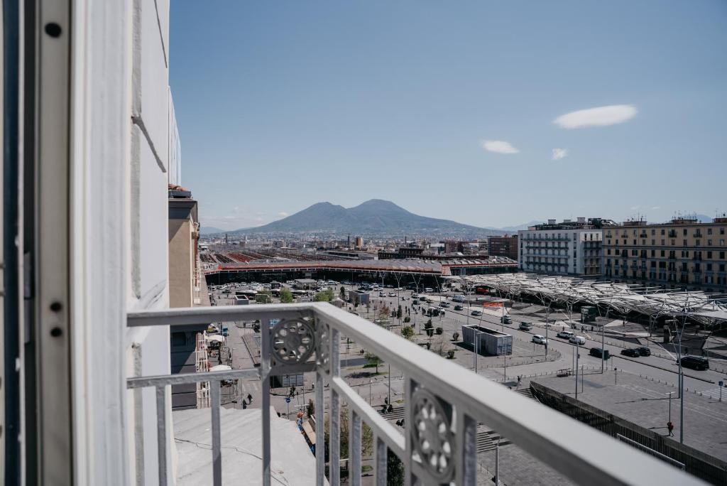 a view of a city from a balcony at Central Station by CasaNapoletana in Naples