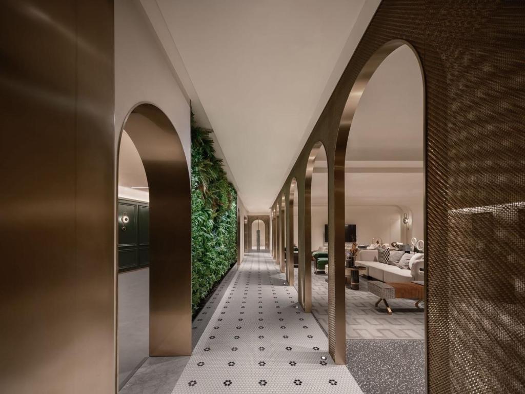 a hallway with arches leading to a bedroom at North Bund 681 in Shanghai