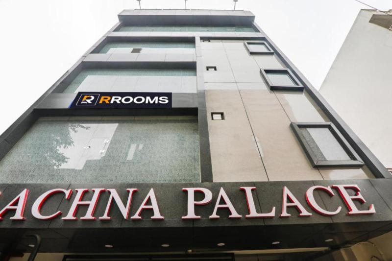 a tall building with a sign on the side of it at RROOMS Rachna Inn in Lucknow