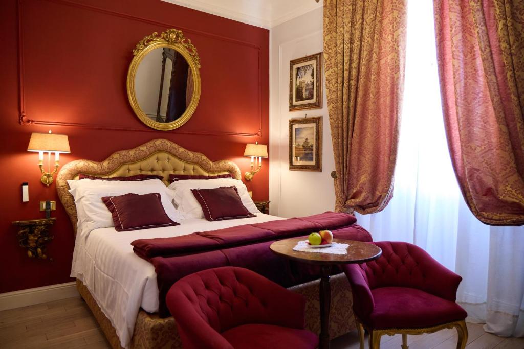 a bedroom with a bed and a table and chairs at Stanze del David Place in Florence