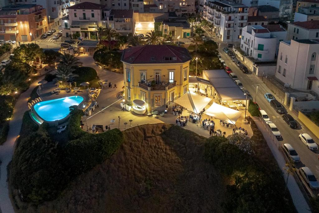 an aerial view of a city at night at Villa Mosca Charming House in Alghero