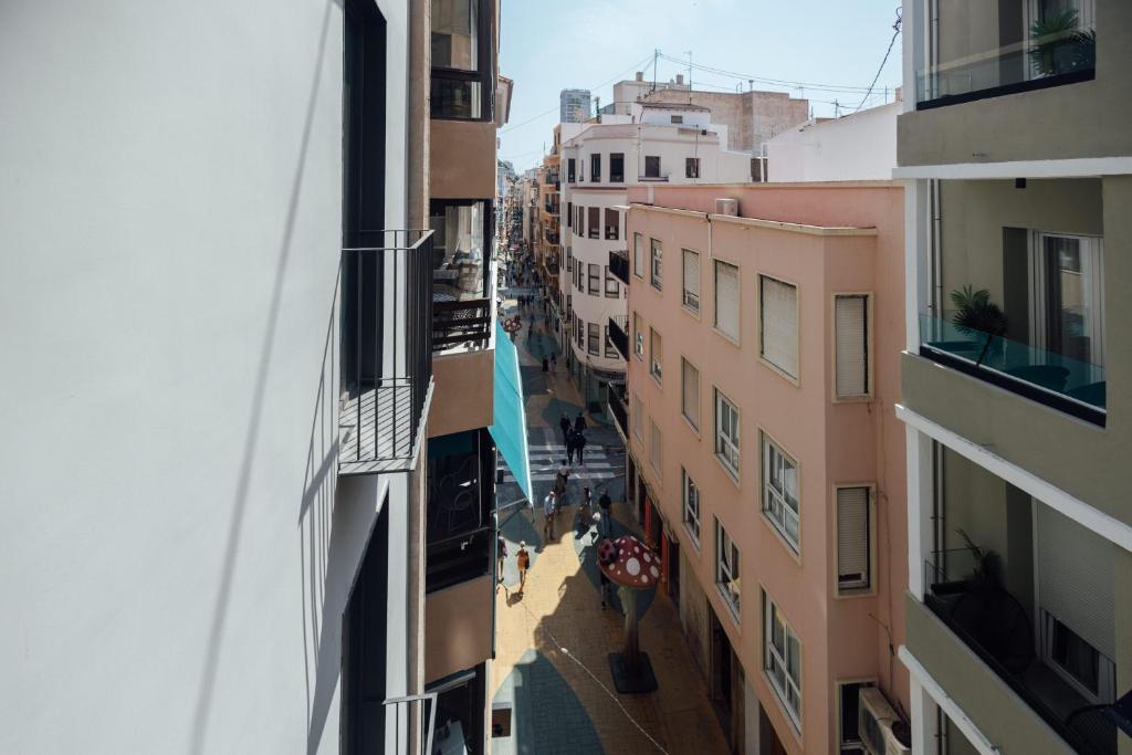 a view of an alley between two buildings at BN SUITES San Francisco in Alicante