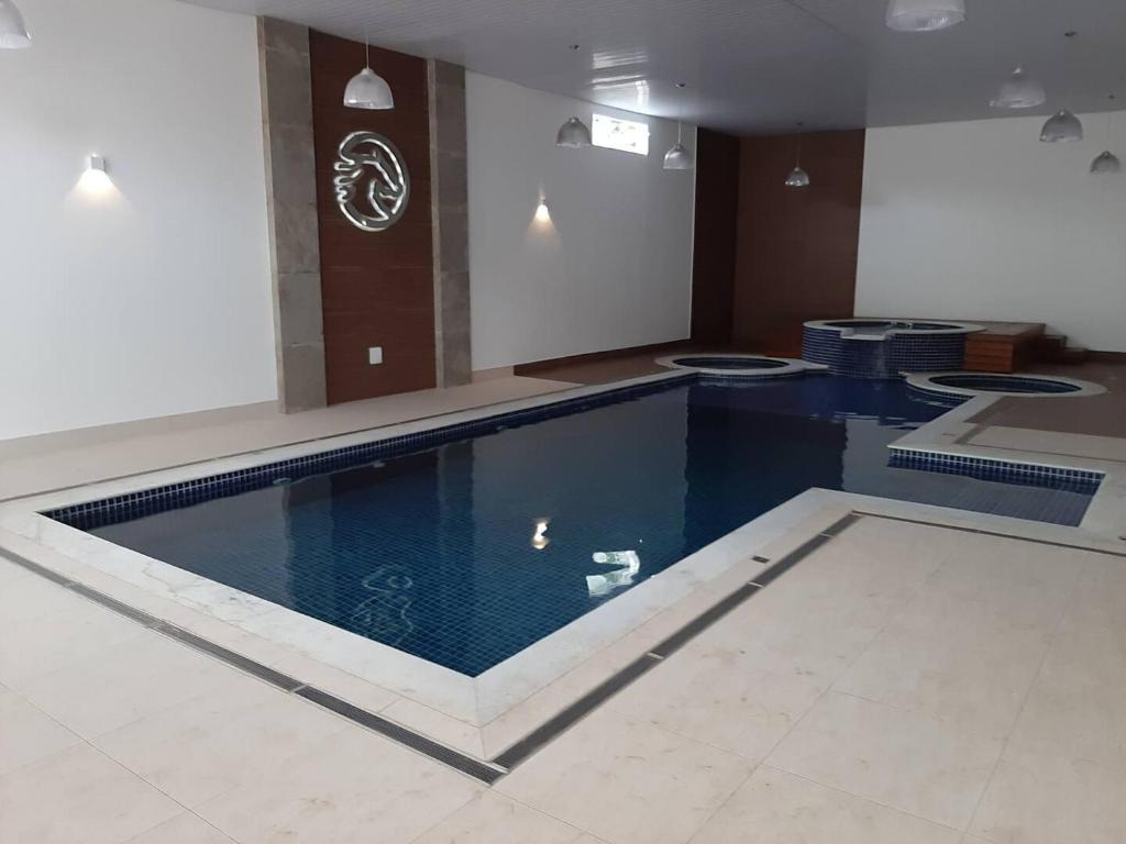 Πισίνα στο ή κοντά στο FLAT 410 no Cond Cavalinho Branco em Aguas de Lindoia