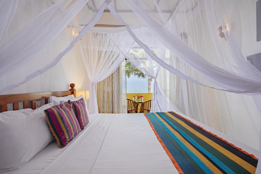Ένα ή περισσότερα κρεβάτια σε δωμάτιο στο Mahi Beach Ayurveda
