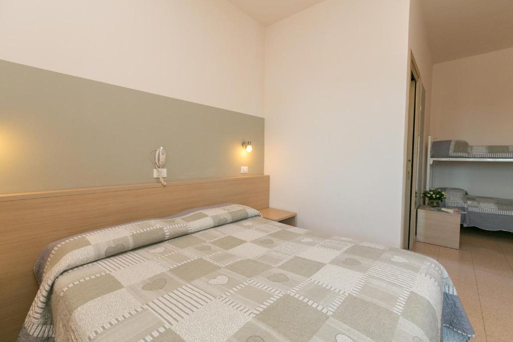 Postel nebo postele na pokoji v ubytování Hotel Colonna