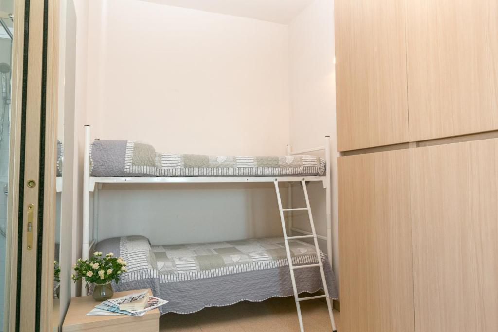 Postel nebo postele na pokoji v ubytování Hotel Colonna