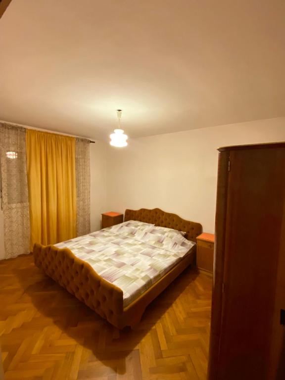 a bedroom with a bed in the middle of a room at Lana in Cetinje